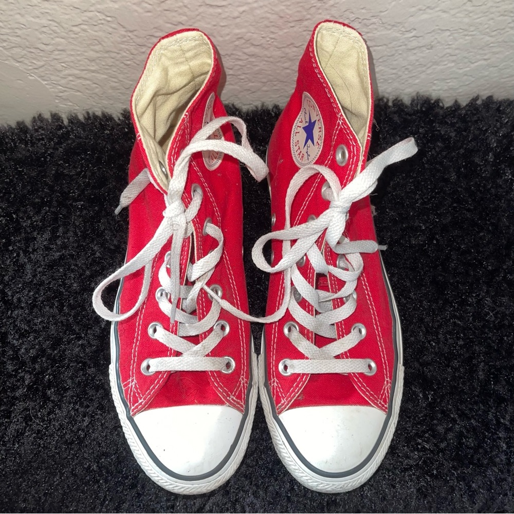Red hightop Chuck Taylor’s